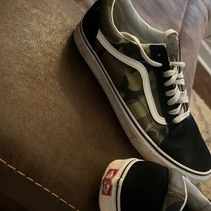 Black and camo Old Skool Off the Wall Vans